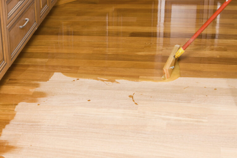 waxing a floor with mop
