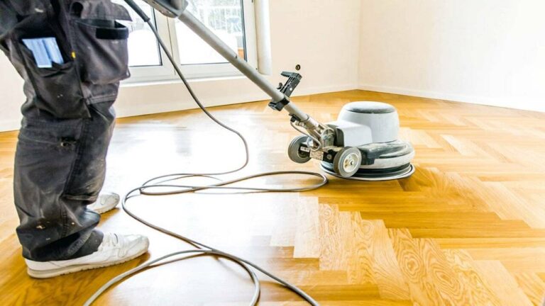 waxing hardwood floor with scrubbing machine.