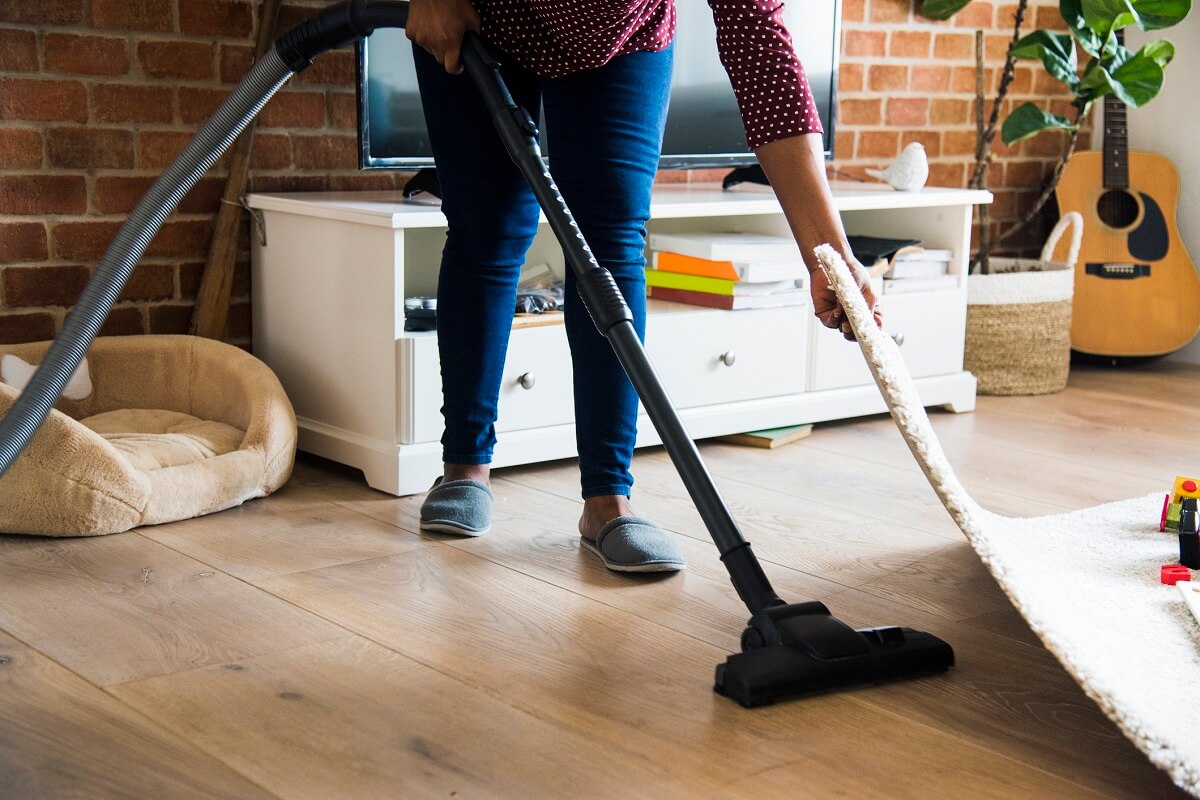 vacuum cleaning under the carpet.