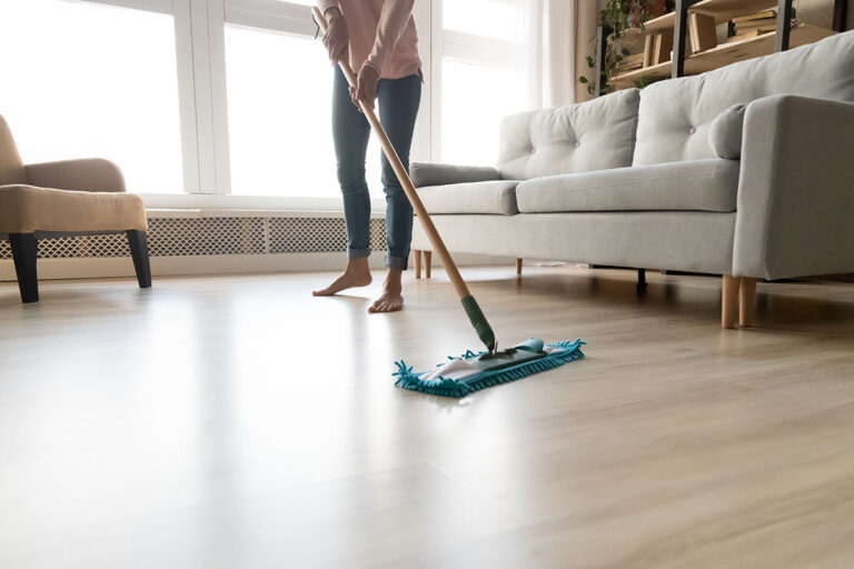 mopping on the shinny hardwood floor.